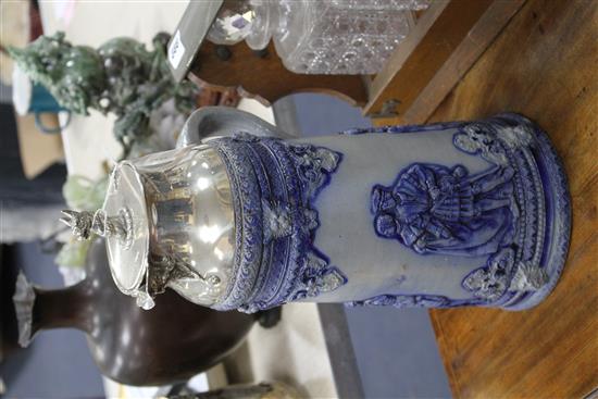 An early 20th century blue glazed German stoneware flagon, with silver plated griffon head mount, height 40cm